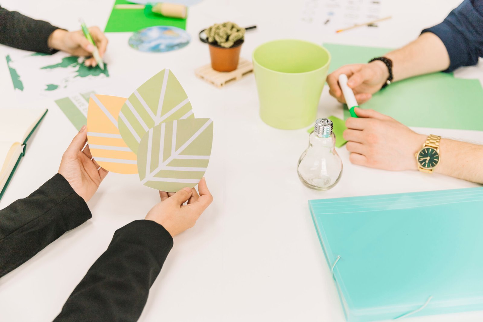 close-up-businessperson-s-hand-holding-eco-icon